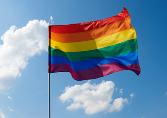 Close up of rainbow flag waving outside