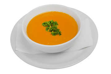Bowl of soup, parsley and croutonson on a white isolated background