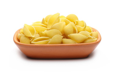 Conchiglie grandi pasta in clay pot, bowl isolated on white background