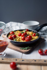 spaghetti with cherry tomatoes in a pan