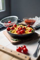 spaghetti with cherry tomatoes in a pan
