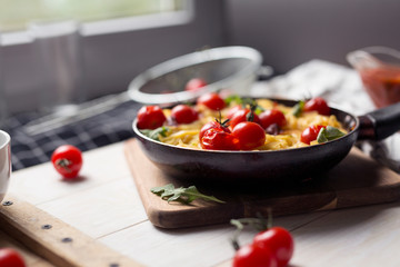 spaghetti with cherry tomatoes in a pan