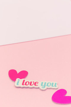 Close up of "I Love You"paper and hearts with copy space.