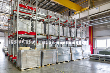 Factory warehouse steel reinforcement. High stacked shelving.