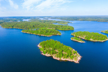 Fototapeta na wymiar Aerial view of green islands and blue lake
