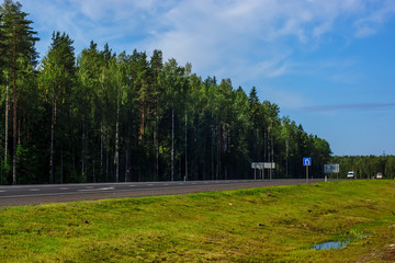 Federal highway through the forests in summer