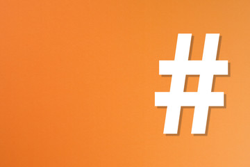 Obraz premium Hashtag sign on orange background 