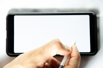 Electronic signature by a male hand on a smartphone with a black frame on a white background close, top, side