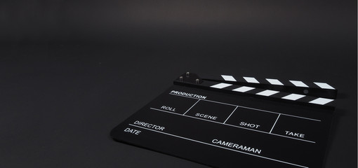 Fototapeta na wymiar Clapperboard or clap board or movie slate use in video production ,film, cinema industry on black background.