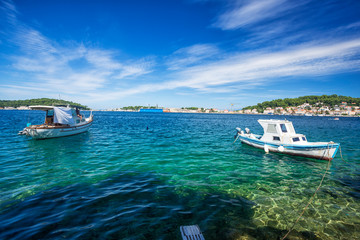 Fototapeta na wymiar boot moored at the wooden pier in harbour of Losinj town, Croatia.
