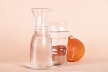Arrangement with different sized glasses and pumpkin