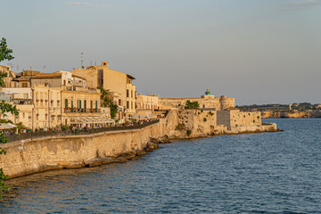 Fototapeta na wymiar Syracuse, Sicily. Beautiful view of the Ionian Sea coastline in Ortigia, Italy