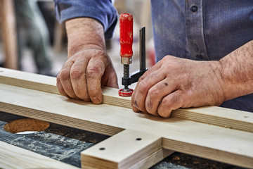 Joinery. Carpenter clamping plywood parts . Furniture manufacture.