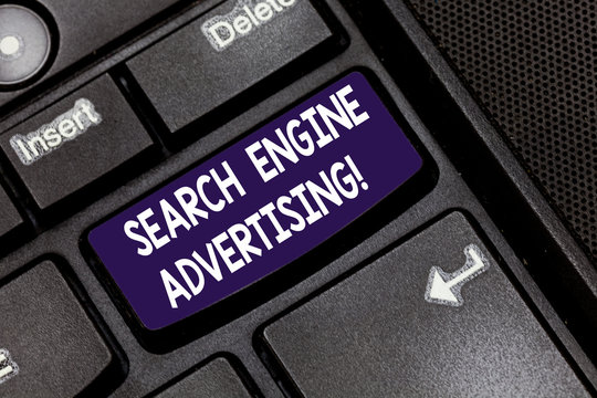 Writing note showing Search Engine Advertising. Business photo showcasing method of placing an online advertisements Keyboard key Intention to create computer message pressing keypad idea