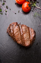 Prepared beef steak served with herbs