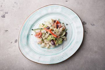 White fish fillet salad served with vegetables