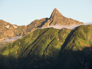 Fototapeta na wymiar 常念岳から見る槍ヶ岳のモルゲンロート