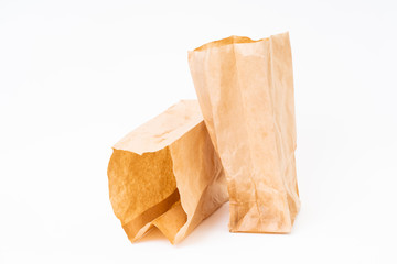 Crumpled brown paper bag on white background