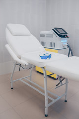 Medical equipment for cosmetology, laser epilation machine, beauty couch. Beautician cabinet, beauty salon interior details