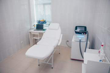 Medical equipment for cosmetology, laser epilation machine, beauty couch. Beautician cabinet, beauty salon interior details