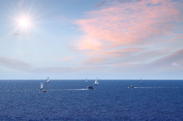 Fototapeta premium Sailboats on sea with sunny sky