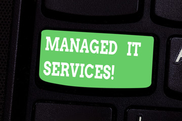 Fototapeta premium Conceptual hand writing showing Managed It Services. Business photo showcasing assumes responsibility providing defined set activities Keyboard key Intention to create computer message idea
