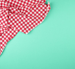 white red checkered kitchen towel on a green background
