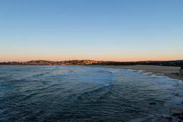 Wide angle view of Curl Curl Beach, Sydney in the morning.