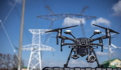 Drone in air nea a bridge and energy objects