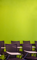 Seminar room with the green wall and lecture chair with nobody
