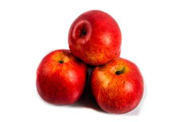 Fototapeta na wymiar three red apples on a white background