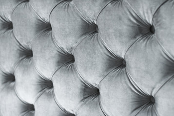 Silver luxury velour quilted sofa upholstery with buttons, elegant home decor texture and background