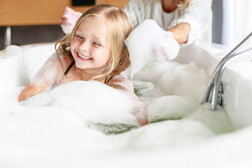 Mom having fun with foam in her hands