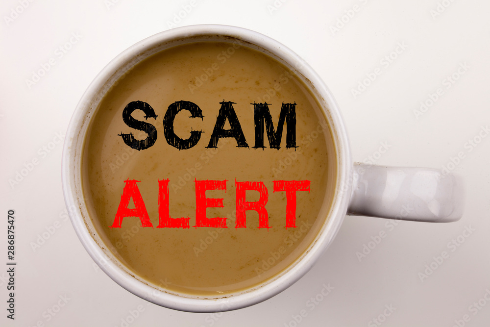 Poster scam alert writing text in coffee in cup. business concept for scam alert on white background with c