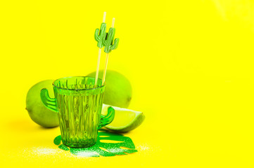 tequila in cactus glass with limes