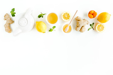 Herbal tea with mint, ginger, lemon, honey and other herbs on white background. Flat lay, top view.