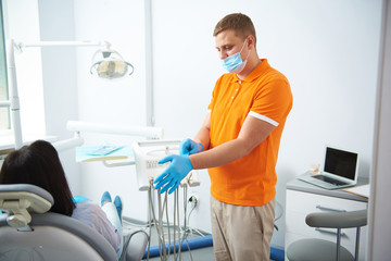 Woman is speaking with dentist in room