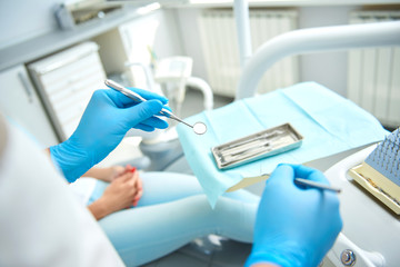 Woman receiving teeth treatment in dental clinic