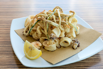 Fried mixed fish with lemon