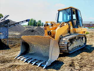 large yellow eath moving bulldozer