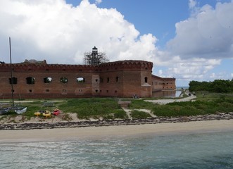Fototapeta na wymiar Medium wide shot of one side of Fort Jefferson at the Dry Tortugas National Park, one of the tourist destinations in Key West, Florida.