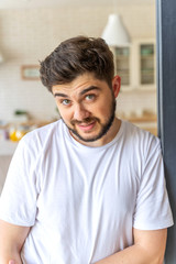 Handsome man is looking surprised with smile