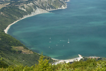 Cliffs and beaches of Mount Conero promontory in the adriatic sea. Ancona, Marche Region, Italy