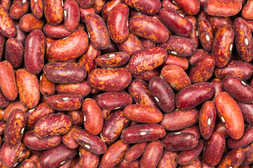 Red kidney bean texture background. Also called Rajma or Mexican Bean. A large, kidney-shaped bean with a subtle sweet flavor and soft texture that keep their shape during cooking.