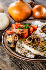 Grilled pork chop with white rice and mushroomson