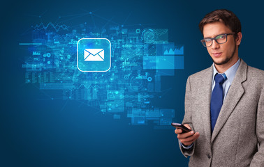 Young person using phone with mail and online communication concept