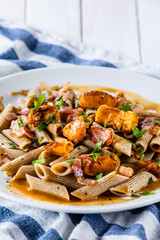 Pasta with chanterelle mushrooms, bacon and sauce