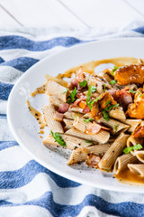 Pasta with chanterelle mushrooms, bacon and sauce