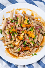 Pasta with chanterelle mushrooms, bacon and sauce