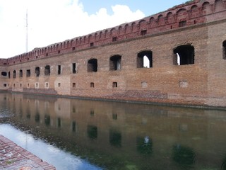 Fort Jefferson reflected in the waters of the moat at the Dry Tortugas National Park, Florida.